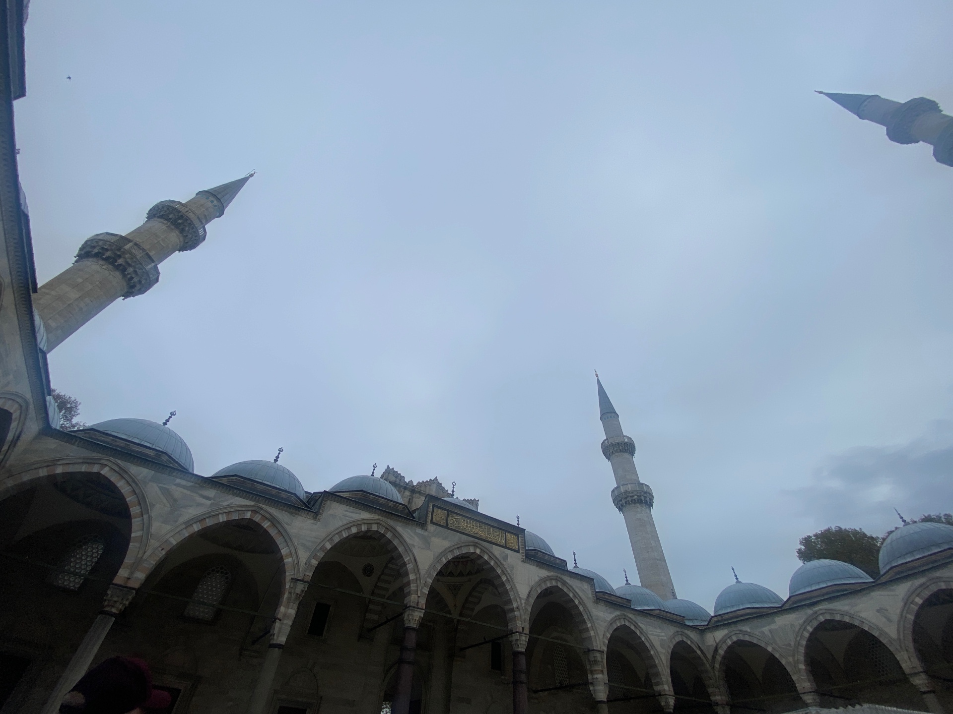 Süleymaniye courtyard — minarets against a soft grey sky