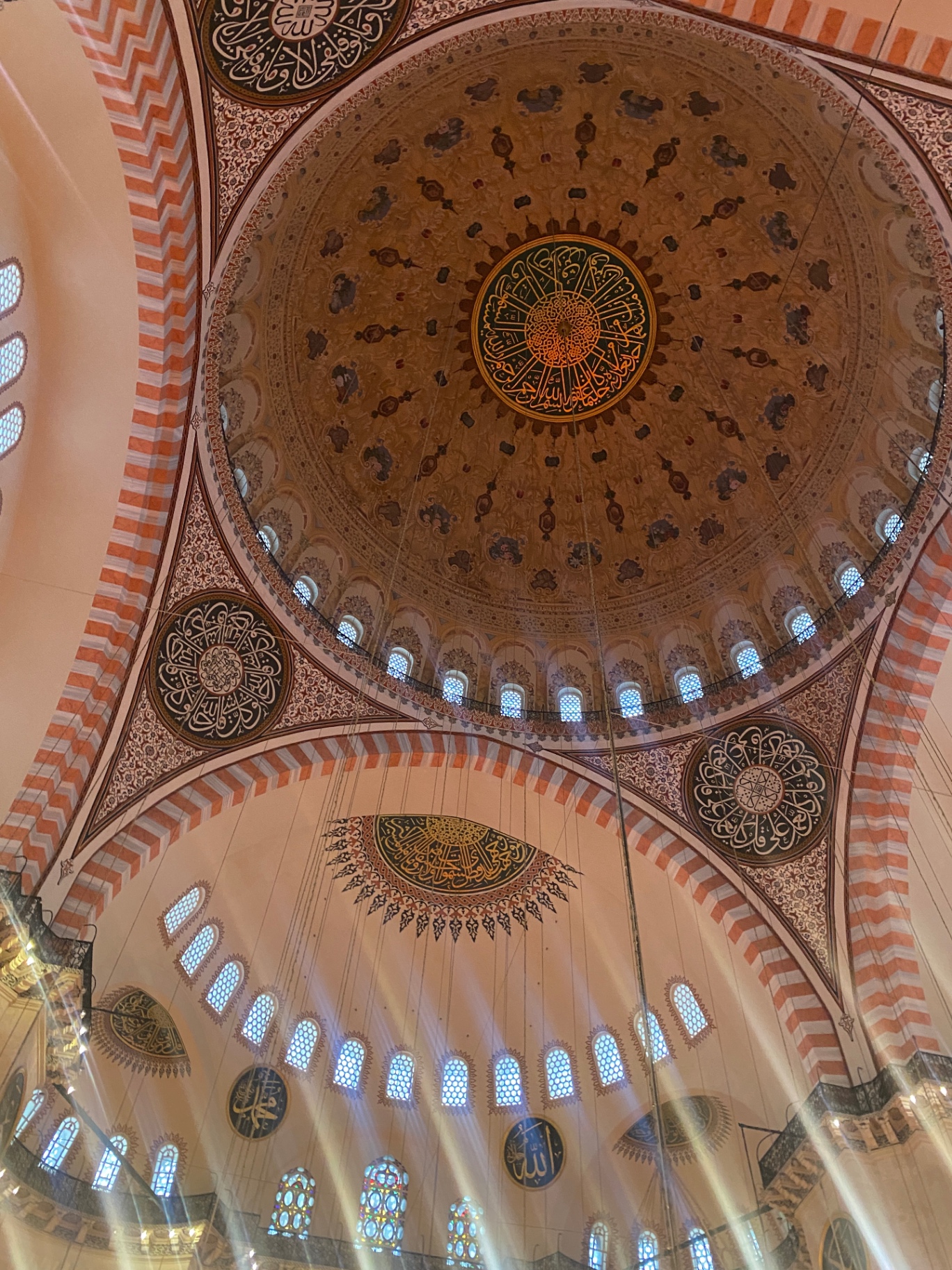Under the dome — calligraphy, light shafts, silence